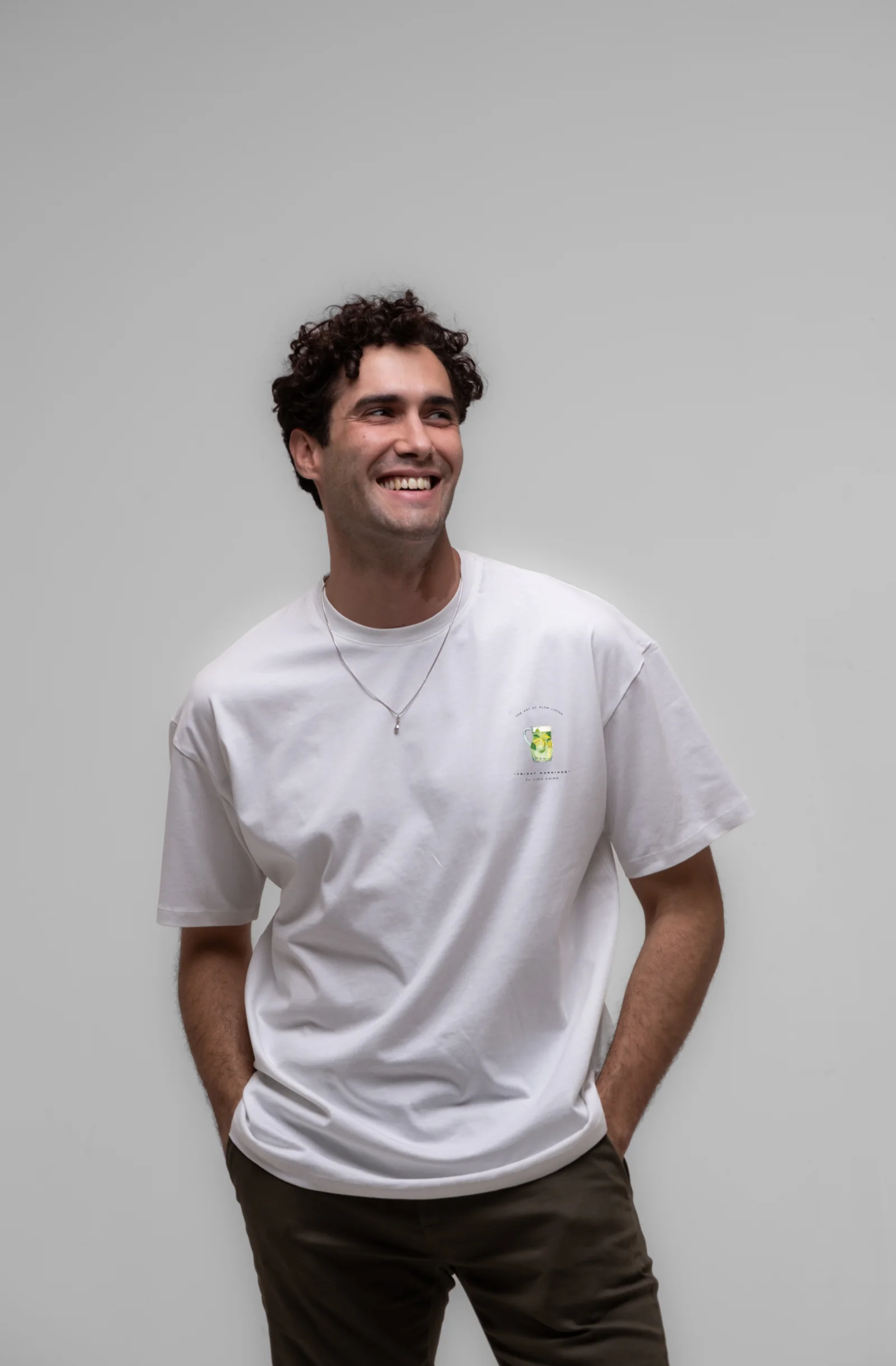 Model smiling in the Friday Mornings White tee